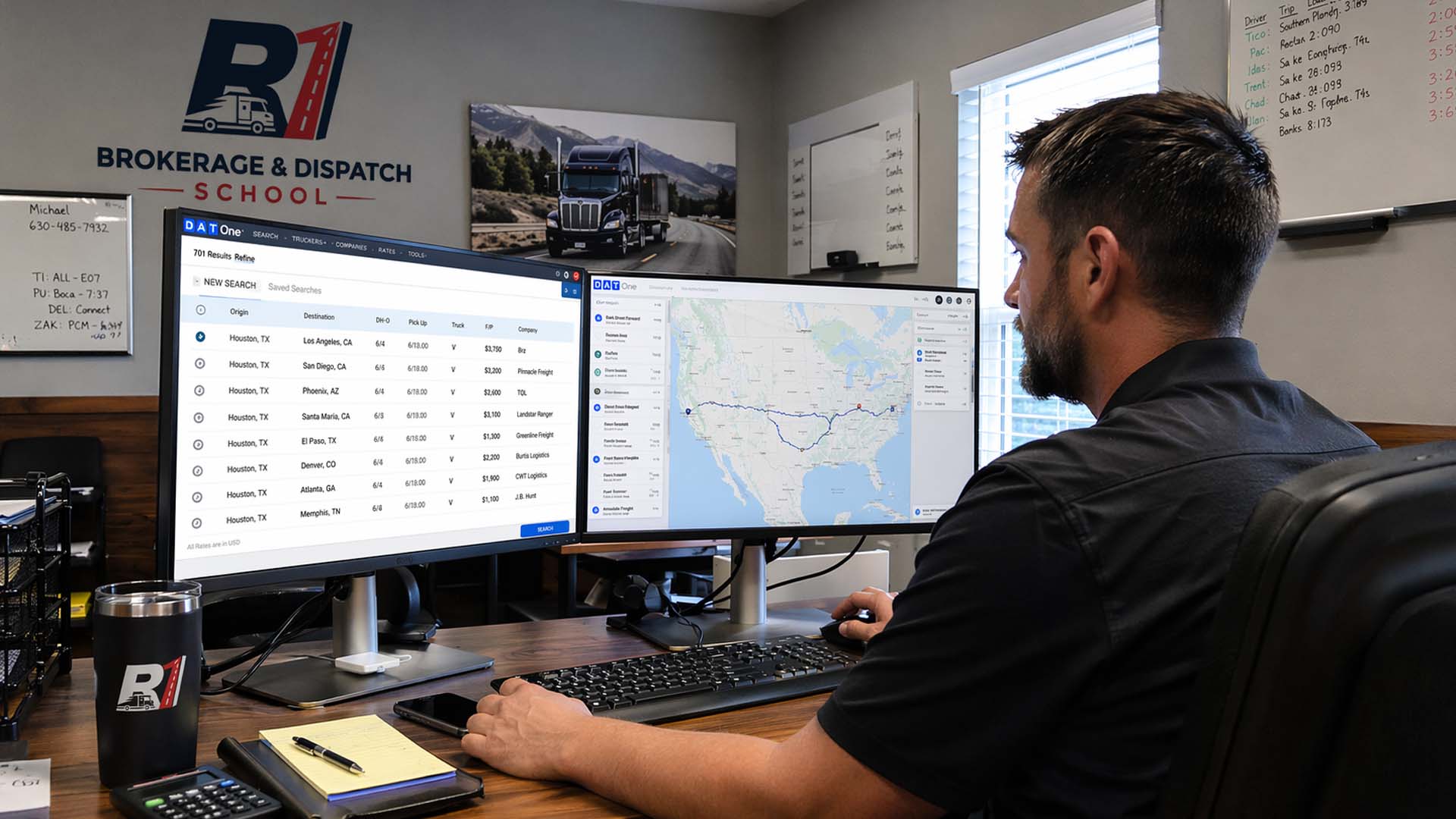 Dispatcher using DAT Load Board on computer for truck dispatching